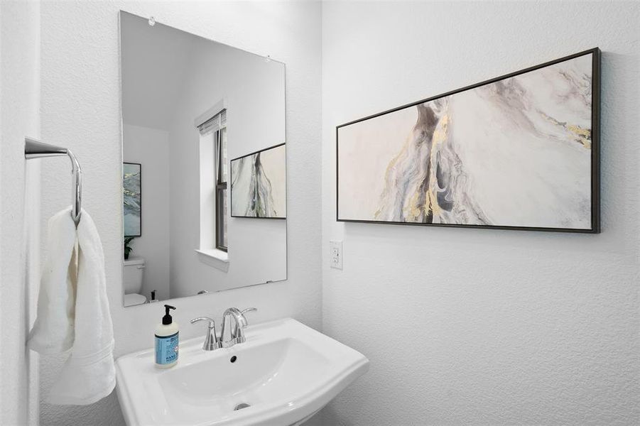 Powder room off of first floor entry