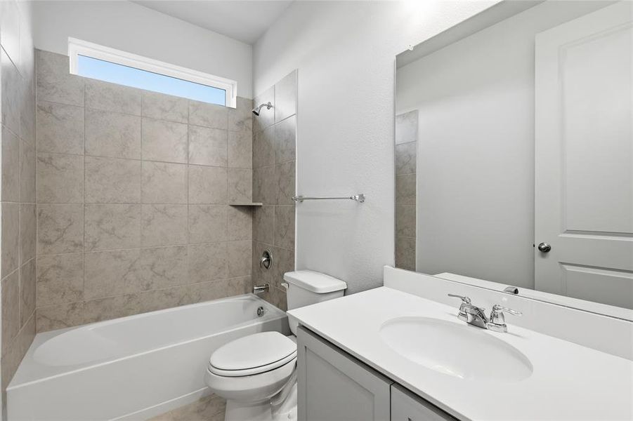 Full bathroom with vanity and bathing tub / shower combination Full bathroom with vanity and bathing tub / shower combination