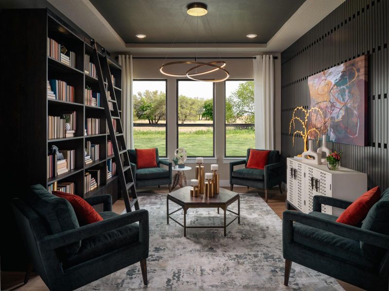 Sitting room with a tray ceiling, wood finished floors, and recessed lighting Sitting room with a tray ceiling, wood finished floors, and recessed lighting