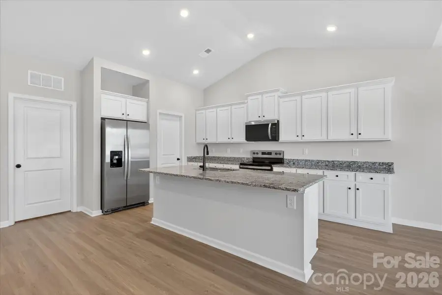 Furnished interior view inside a new home in Stagecoach Station, Gastonia (Image 5).