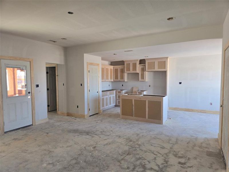 Kitchen featuring light brown cabinets and a center island