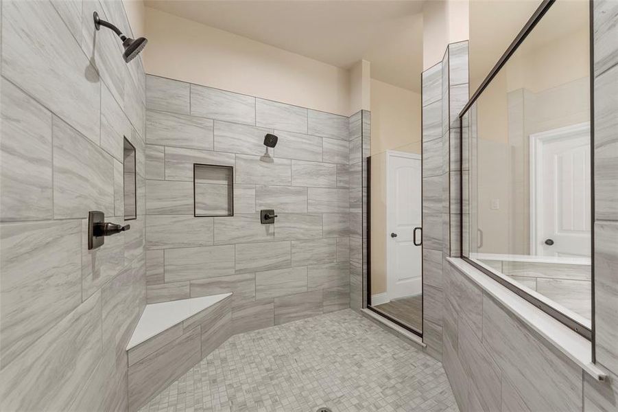Bathroom featuring a shower stall