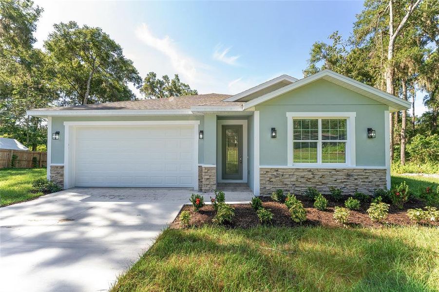 Front exterior of a new home in , Belleview, FL, highlighting curb appeal (Image 26).