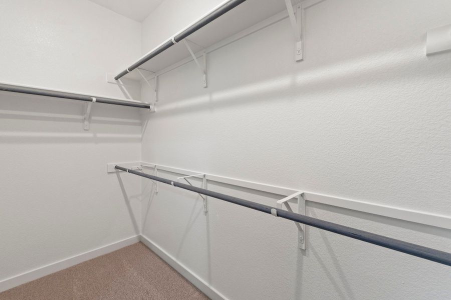 Primary Closet in the Pearl home plan by Trophy Signature Homes – REPRESENTATIVE PHOTO Primary Closet in the Pearl home plan by Trophy Signature Homes – REPRESENTATIVE PHOTO
