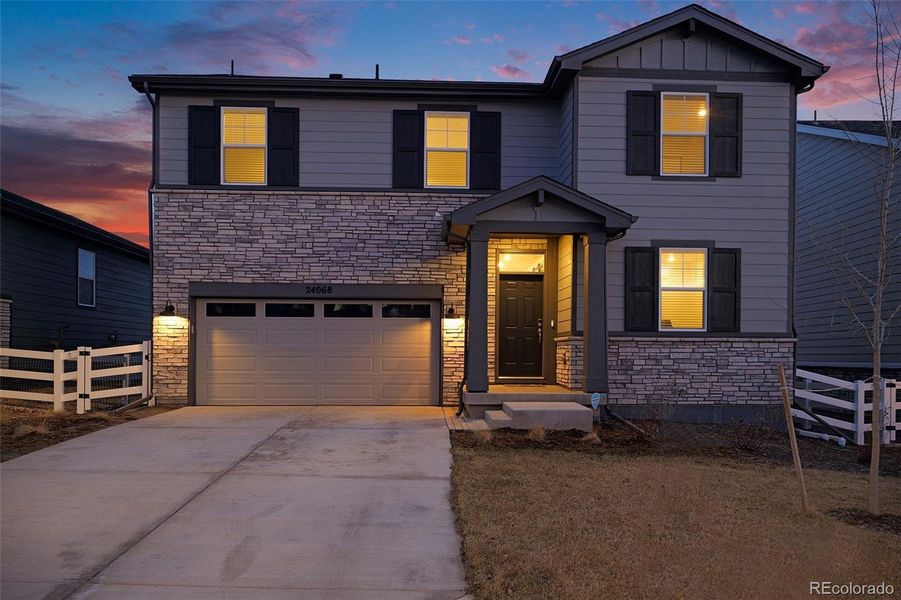 Front exterior of a new home in Murphy Creek, Aurora, CO, highlighting curb appeal (Image 25).