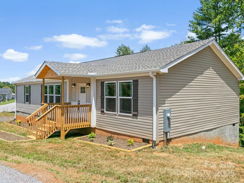 Front exterior of a new home in , Weaverville, NC, highlighting curb appeal (Image 2). Front exterior of a new home in , Weaverville, NC, highlighting curb appeal (Image 2).