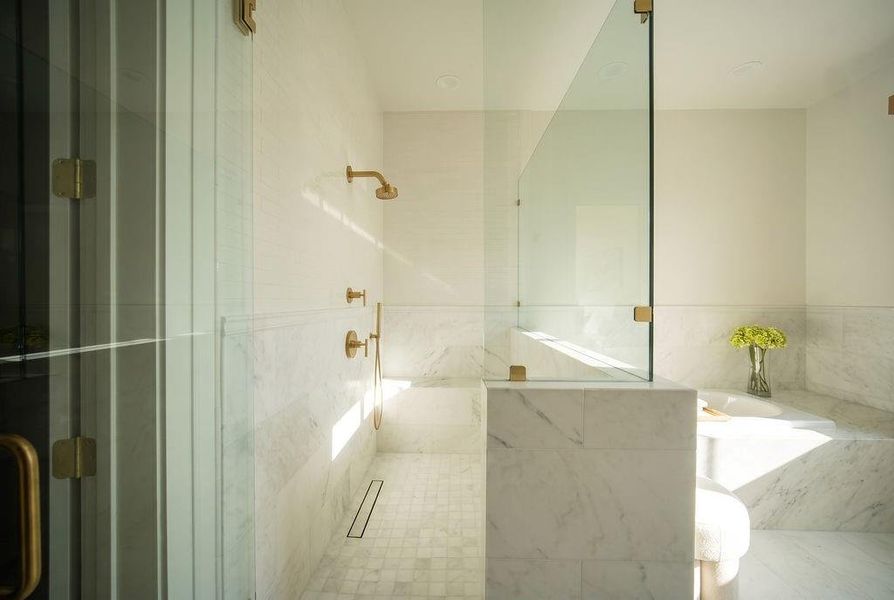 Upstairs primary shower and tub Upstairs primary shower and tub