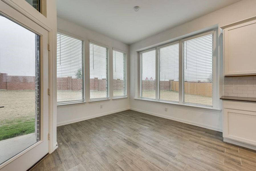 Unfurnished dining area with light wood-type flooring