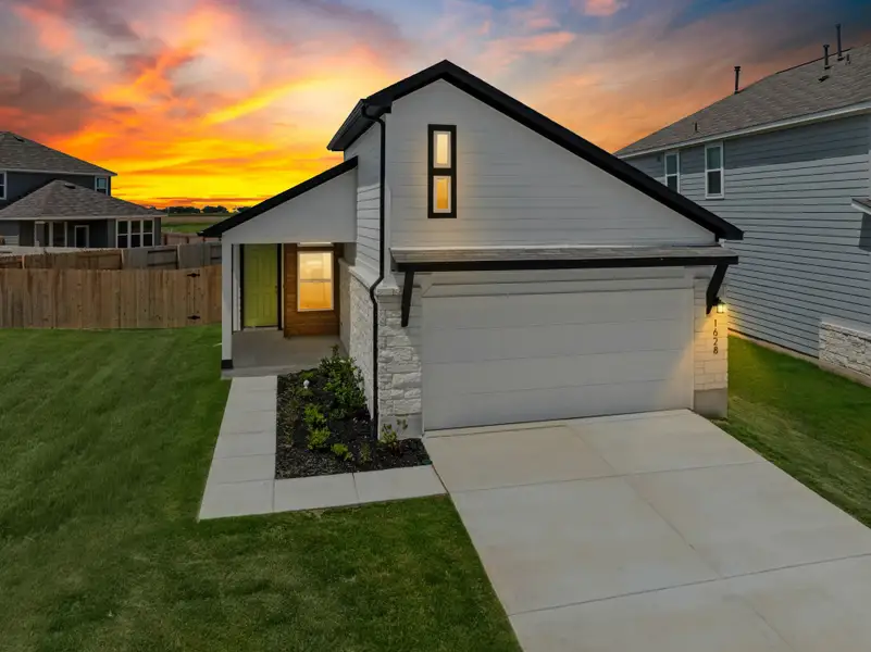 Front exterior of a new home in Willowbrook, New Braunfels, TX, highlighting curb appeal (Image 1). Front exterior of a new home in Willowbrook, New Braunfels, TX, highlighting curb appeal (Image 1).