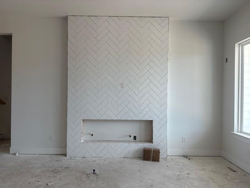 Unfurnished living room with plenty of natural light