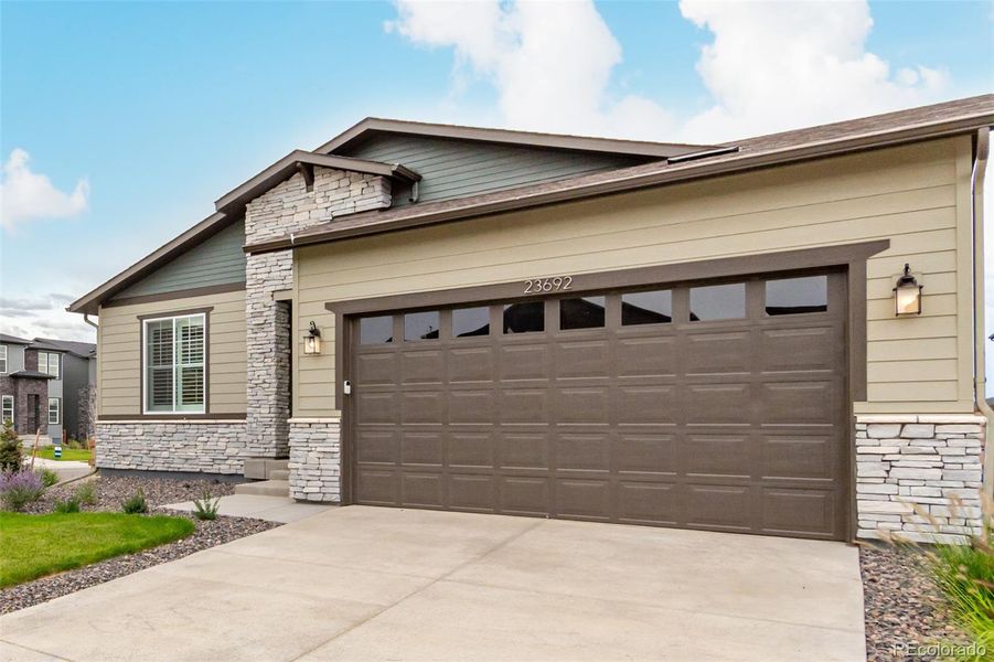 Front exterior of a new home in , Aurora, CO, highlighting curb appeal (Image 25).