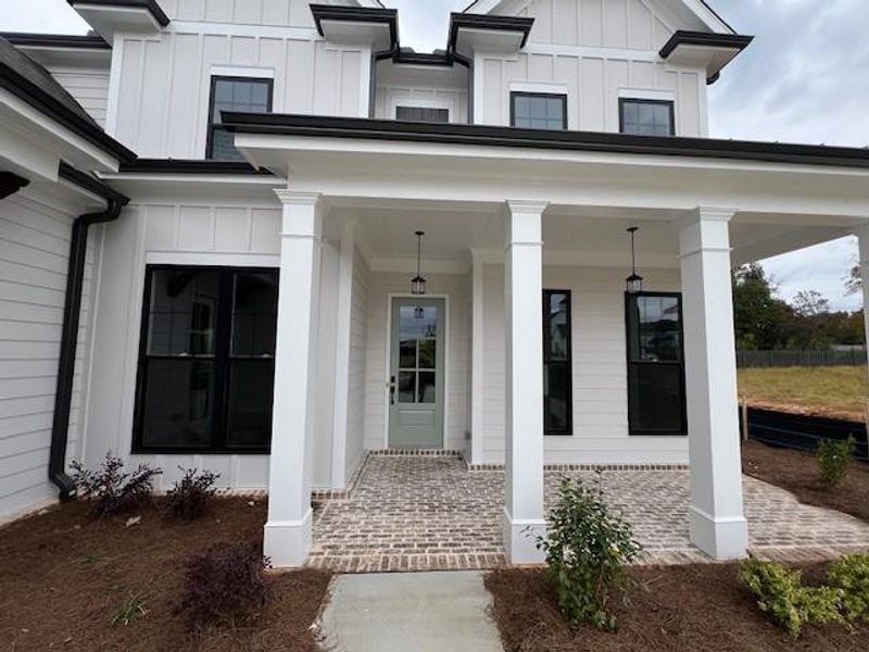 Exterior details and patio area of a home in Promenade at Sawnee Village, Cumming (Image 2). Exterior details and patio area of a home in Promenade at Sawnee Village, Cumming (Image 2).