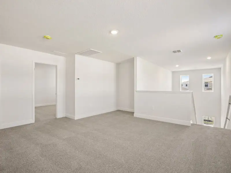 Spacious, unfurnished interior of a new home in Villamar - Classic Series, Winter Haven (Image 8).