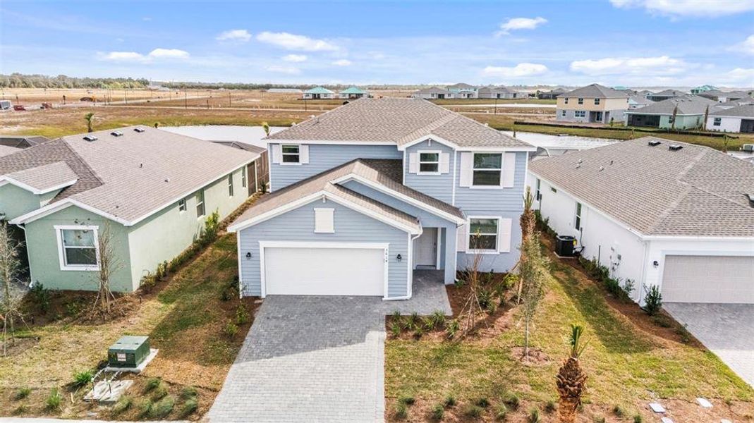 Front exterior of a new home in Rye Ranch: Executive Homes, Parrish, FL, highlighting curb appeal (Image 2).