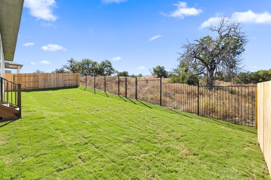 Exterior details and patio area of a home in Lariat, Liberty Hill (Image 25).