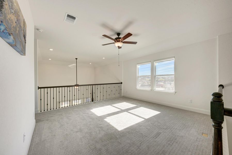 Unfurnished room featuring ceiling fan, carpet floors, and recessed lighting