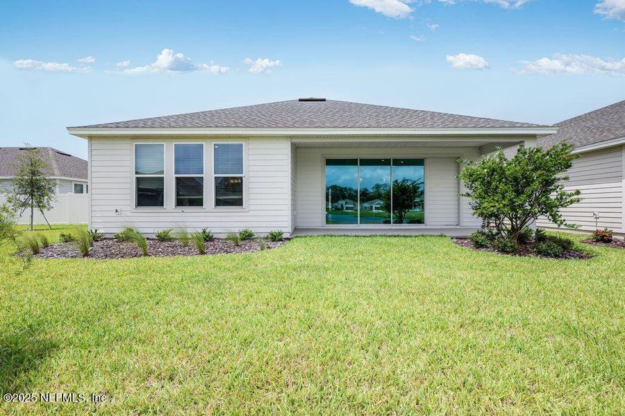 Front exterior of a new home in Colbert Landings, Palm Coast, FL, highlighting curb appeal (Image 16).