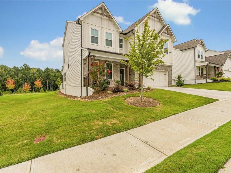 Front exterior of a new home in Pine Mountain Park, Kennesaw, GA, highlighting curb appeal (Image 20).