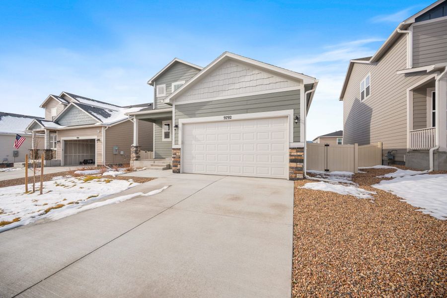 Front exterior of a new home in Aspen Ranch, Fountain, CO, highlighting curb appeal (Image 2). Front exterior of a new home in Aspen Ranch, Fountain, CO, highlighting curb appeal (Image 2).