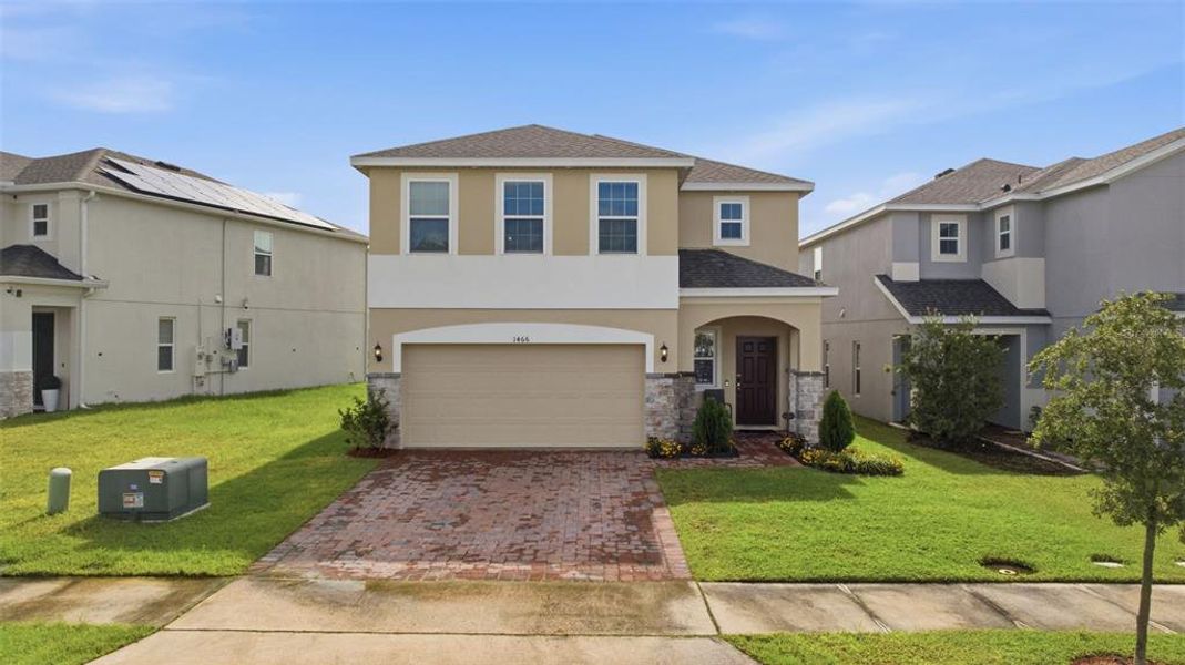 Front exterior of a new home in , Kissimmee, FL, highlighting curb appeal (Image 22). Front exterior of a new home in , Kissimmee, FL, highlighting curb appeal (Image 22).