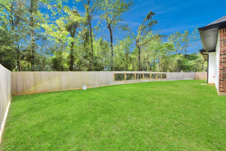 Additional side view showcasing space for playground or even a pool!