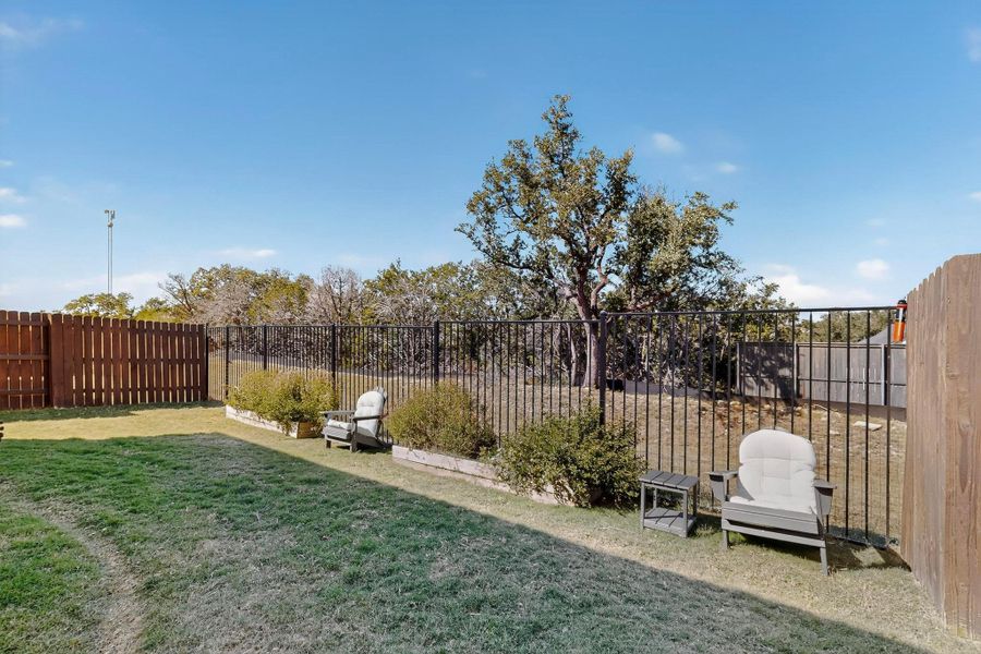 View of fenced backyard
