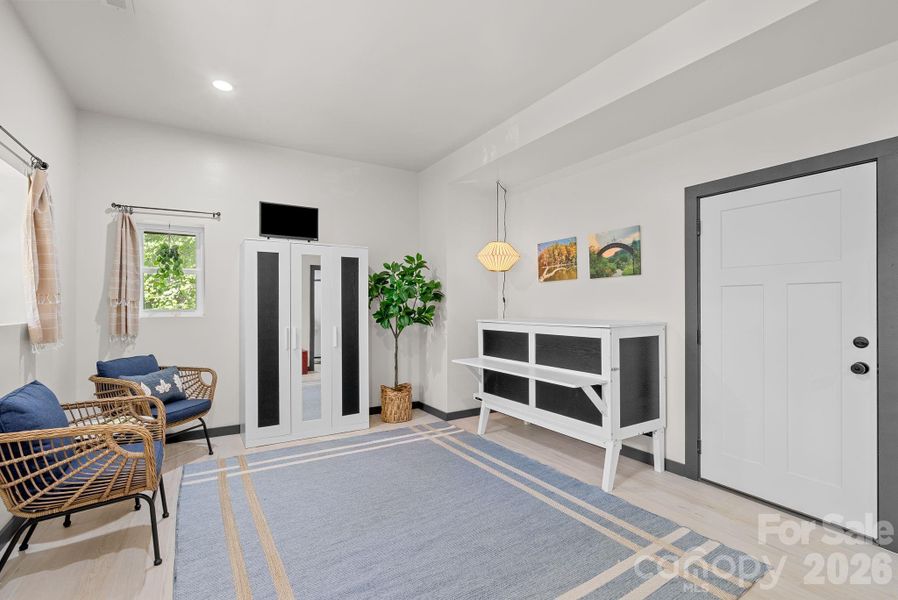 Step inside the studio apartment downstairs.