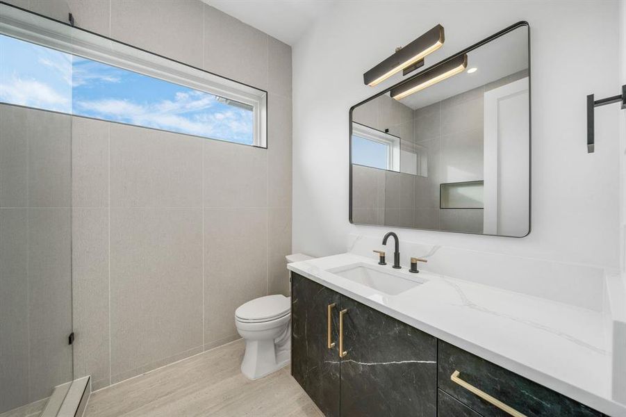 Full bathroom with light wood finished floors and vanity Full bathroom with light wood finished floors and vanity