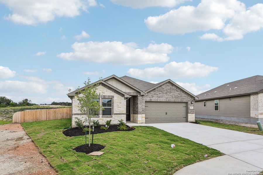 Front exterior of a new home in , Cibolo, TX, highlighting curb appeal (Image 24). Front exterior of a new home in , Cibolo, TX, highlighting curb appeal (Image 24).