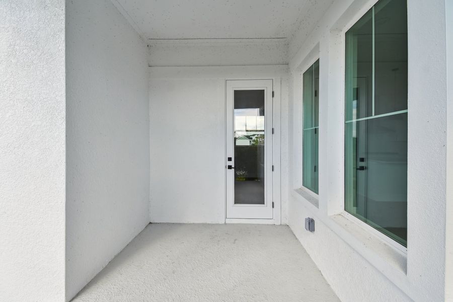Exterior details and patio area of a home in Emerald Landing at Waterside at Lakewood Ranch – Cottage Series, Sarasota (Image 3).