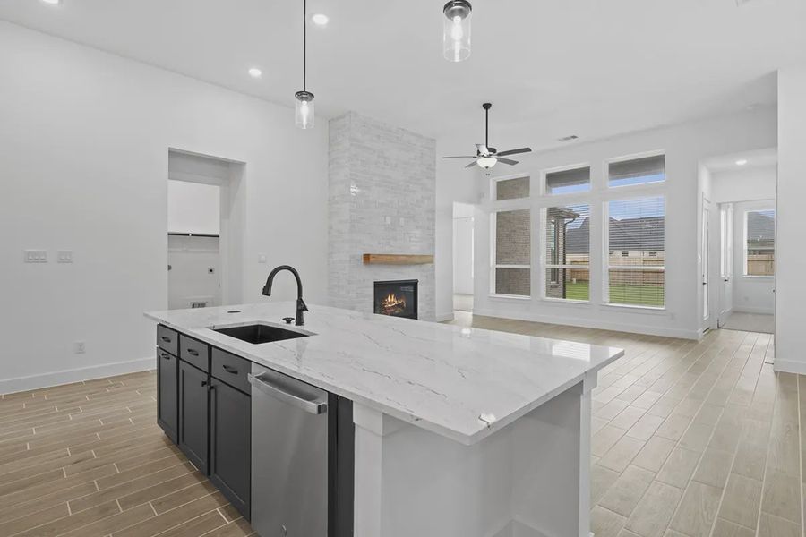 Representative furnished interior of a home built from the Summerton by Chesmar Homes in University Heights, Round Rock (Image 11).