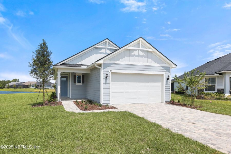 Front exterior of a new home in Seabrook Village at Nocatee, Ponte Vedra, FL, highlighting curb appeal (Image 1). Front exterior of a new home in Seabrook Village at Nocatee, Ponte Vedra, FL, highlighting curb appeal (Image 1).