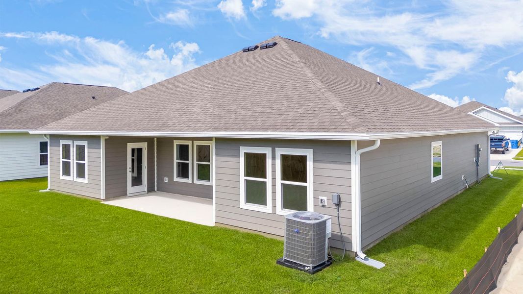 Front exterior of a new home in Titus Park, Panama City, FL, highlighting curb appeal (Image 17).