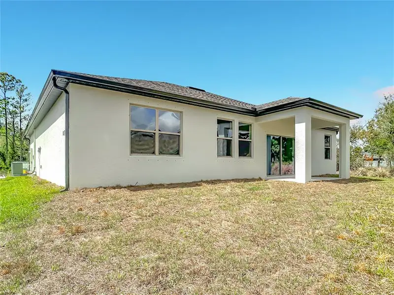 Exterior details and patio area of a home in , North Port (Image 4).