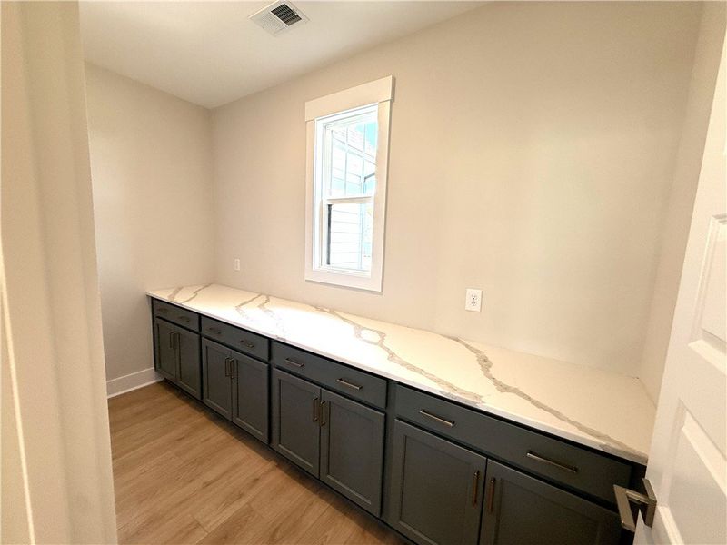 This bright space features sleek cabinetry and ele