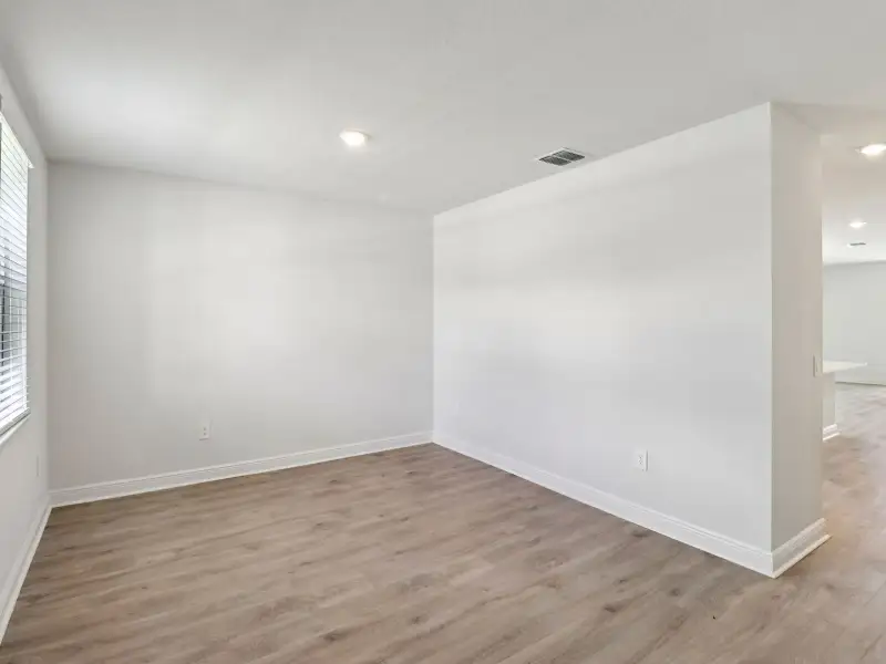 Spacious, unfurnished interior of a new home in The Reserve at Hammock Oaks - Signature Series, Lady Lake (Image 10).