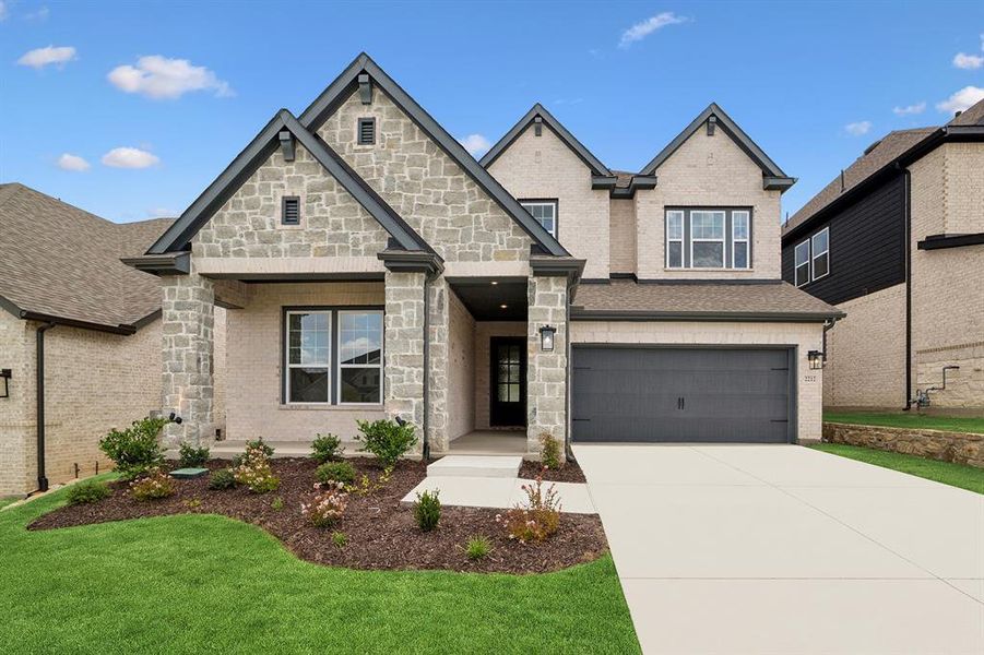 Front exterior of a new home in Pecan Square - Gardens, Northlake, TX, highlighting curb appeal (Image 2). Front exterior of a new home in Pecan Square - Gardens, Northlake, TX, highlighting curb appeal (Image 2).