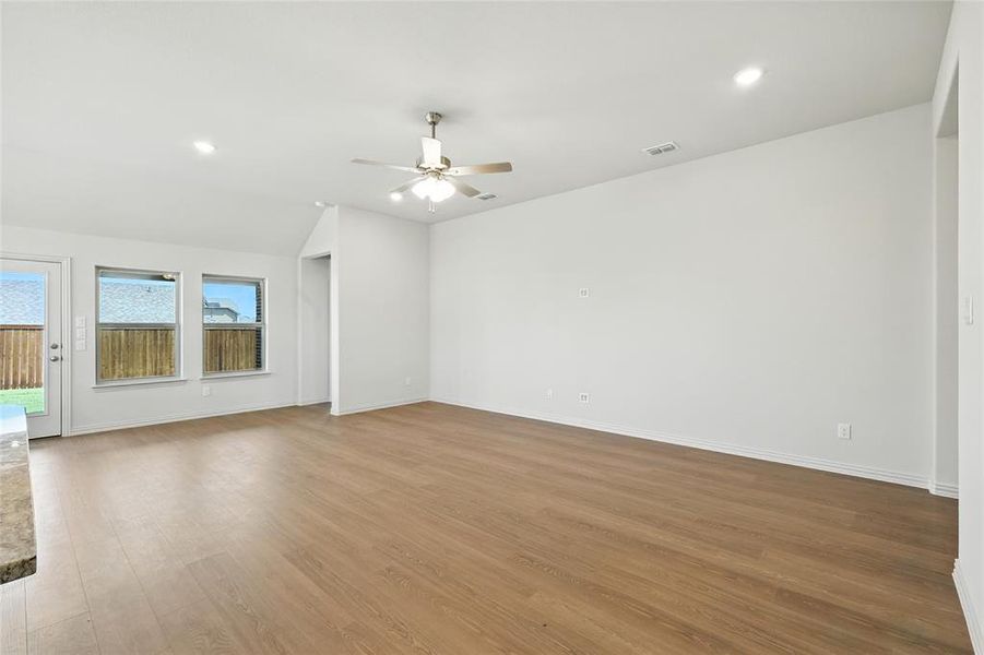 Unfurnished living room featuring light wood-style floors, recessed lighting, and ceiling fan Unfurnished living room featuring light wood-style floors, recessed lighting, and ceiling fan