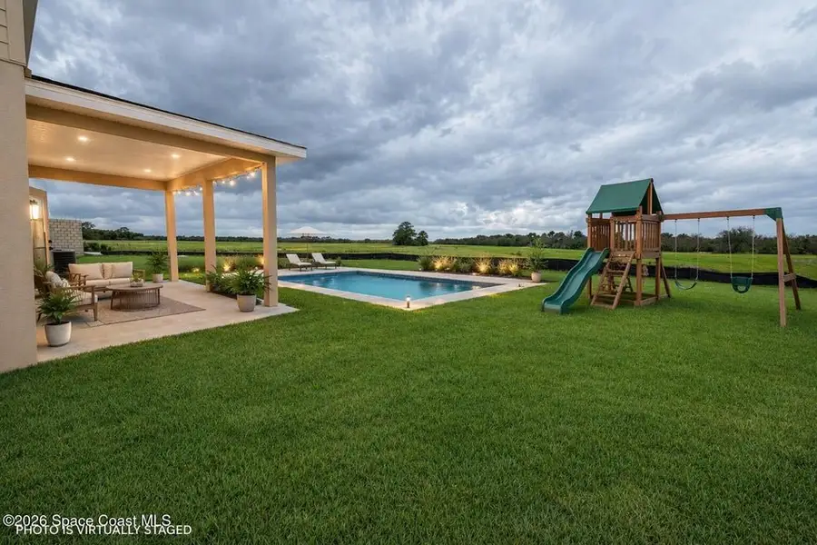 Exterior details and patio area of a home in St. John's Preserve, Palm Bay (Image 4).