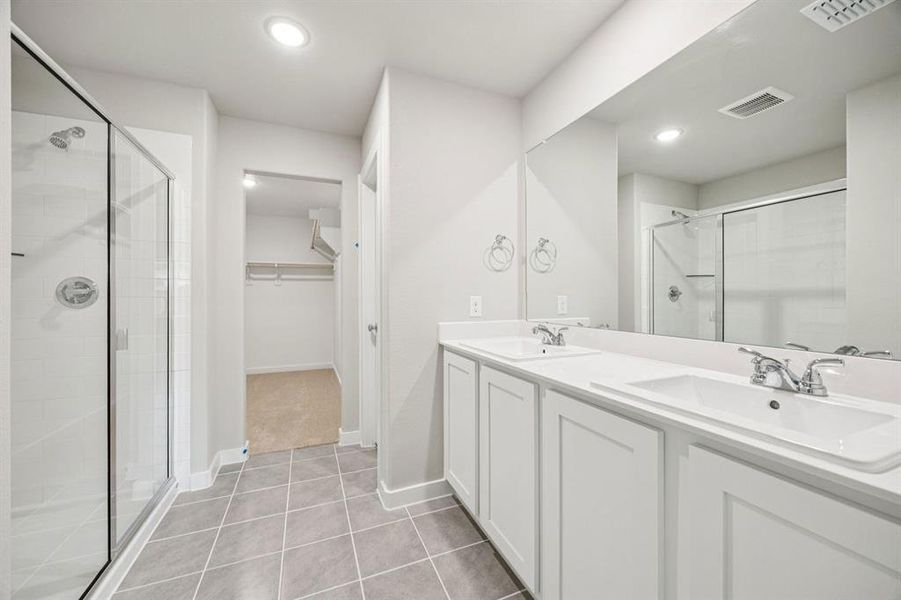 Primary Bathroom in the Hayden home plan by Trophy Signature Homes – REPRESENTATIVE PHOTO