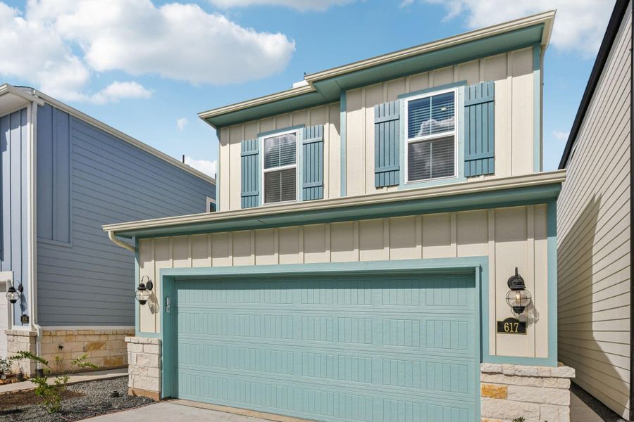 Front exterior of a new home in Kemah Crossing - City Series, Kemah, TX, highlighting curb appeal (Image 1).