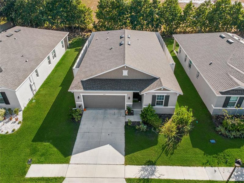 Front exterior of a new home in , Winter Haven, FL, highlighting curb appeal (Image 1).