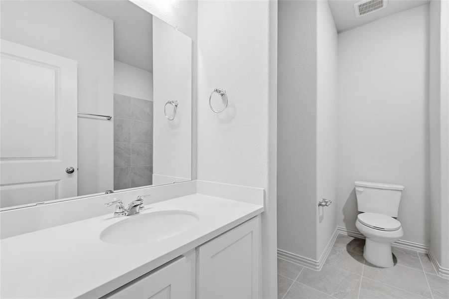 Bathroom featuring vanity and light tile patterned floors
