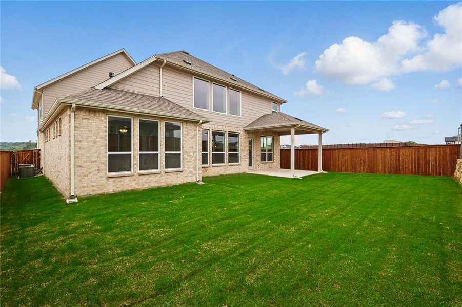 Back of property featuring a patio area, brick siding, a shingled roof, and central AC unit Back of property featuring a patio area, brick siding, a shingled roof, and central AC unit