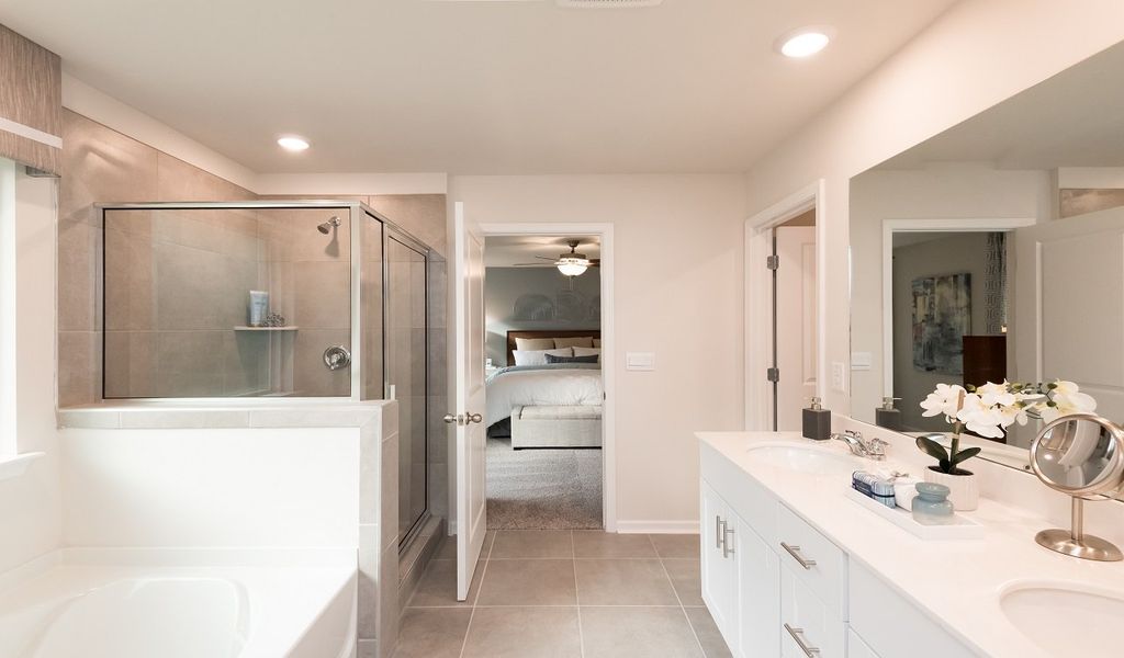 Ensuite bathroom features a spacious walk-in closet.