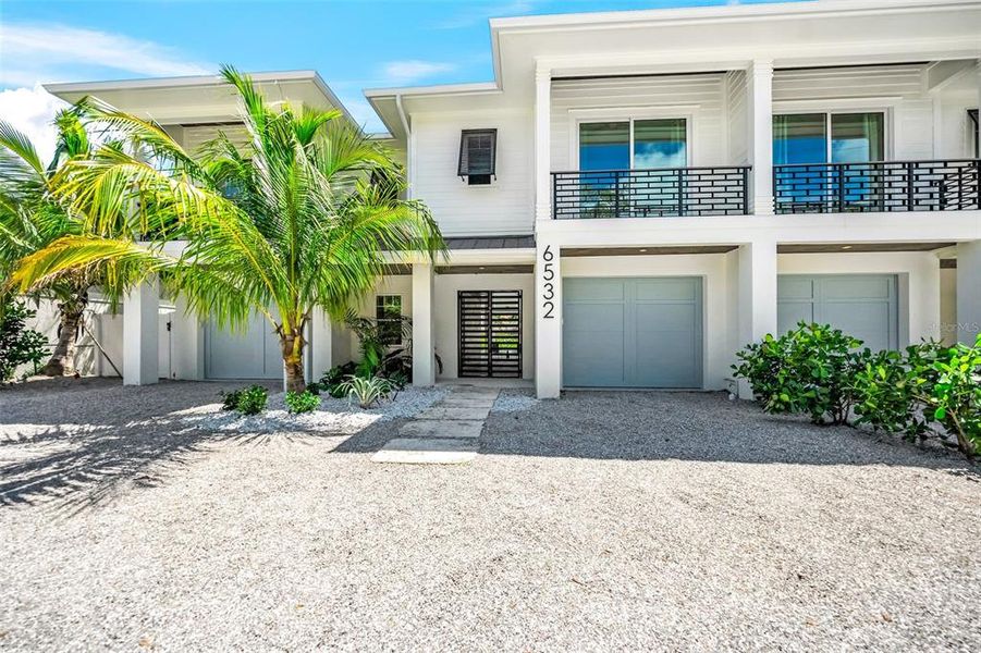 Front exterior of a new home in , Sarasota, FL, highlighting curb appeal (Image 30).