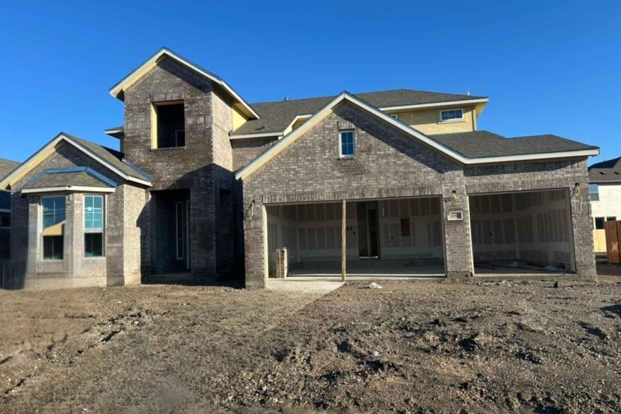 View of front facade featuring brick siding