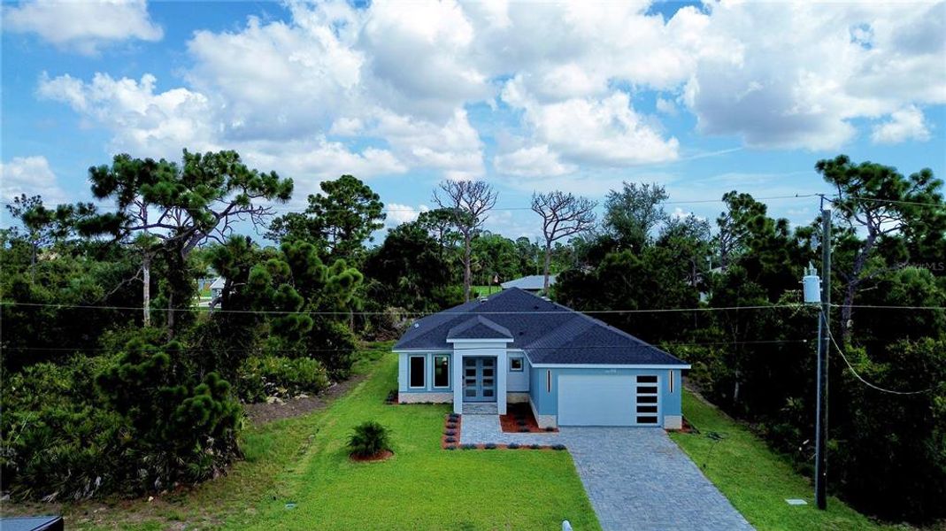 Front exterior of a new home in , Rotonda West, FL, highlighting curb appeal (Image 2). Front exterior of a new home in , Rotonda West, FL, highlighting curb appeal (Image 2).