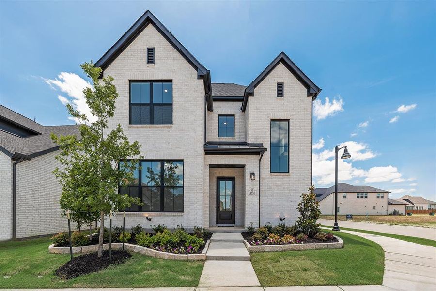 Front exterior of a new home in Cottages of Celina, Celina, TX, highlighting curb appeal (Image 24).