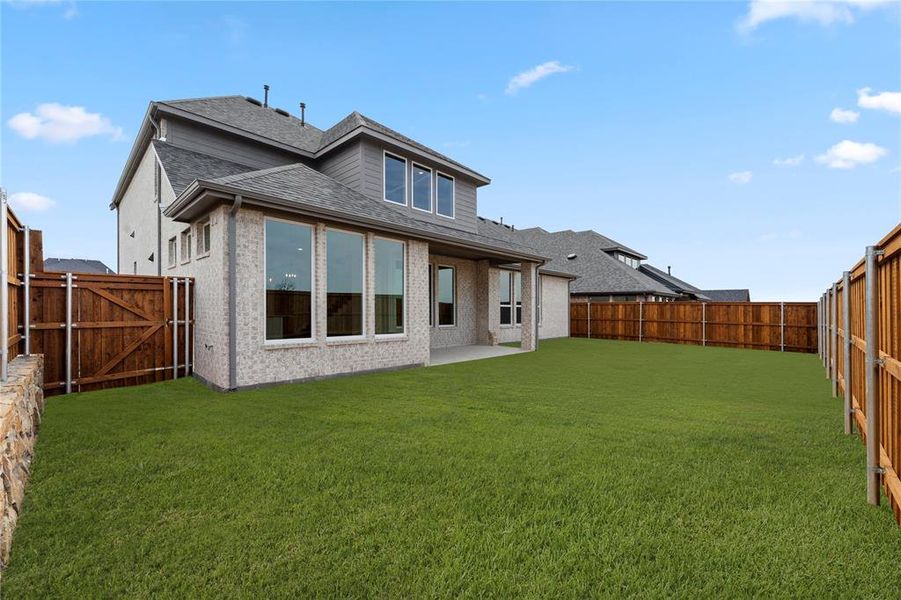 Exterior details and patio area of a home in The Homestead - 62', Rockwall (Image 4).